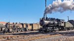 Shiny 0-6-0 steam locomotive 26 passing somewhat less shiny museum piece CN 47 in the Steamtown Yard